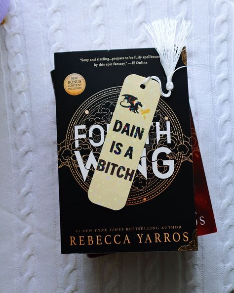 Did I need 3 copies of Fourth Wing? Yes, yes I did. I also added my corner protectors to it the second it arrived, because WHO SHIPS A PAPERBACK BOOK WITH A HUGE BOTTLE OF BUBBLE BATH AND THATS IT?! So my corners were a little scuffed. Either way, I now have my annotated version, my sprayed edges hardcover, and my sprayed edges paperback. I am a happy bookish goblin today. Now I think it's time for a r#fourthwing Also swipe for the best bookmark ever 😉😂 #shhsamsreading #bookish #fourthwing Best Bookmarks, Fourth Wing, Corner Protectors, Yes I Did, Bubble Bath, Paperback Books, Bestselling Author, New York Times, A R