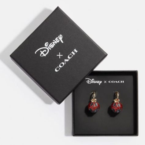 Get these Coach X Disney Villains Snow White Poison Apple Huggie Earrings for only $24.50 (reg. $98) at the COACH Outlet store. You save 75% off the retail price for these Disney inspired earrings. Plus, these earrings ship free on orders over $50. The Coach X Disney Villains Snow White Earrings (CD812) feature a resin […] The post Coach X Disney Villains Snow White Poison Apple Huggie Earrings first appeared on Frugal Buzz. Snow White Poison Apple, Coach X Disney, Coach Earrings, Coach Disney, Apple Earrings, Poison Apple, Rose Gold Earrings Studs, Coach Jewelry, Rose Gold Studs