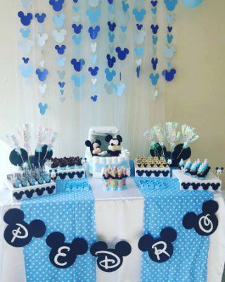 I really like the mickey hanging backdrop. That could be a big part of a photo "booth". Baby Onesies For Boys, Γενέθλια Mickey Mouse, Theme Bapteme, Mickey Baby Showers, Mickey 1st Birthdays, Mickey Mouse Baby Shower, Mickey Baby, Mickey Birthday Party, Baby Shower Deco