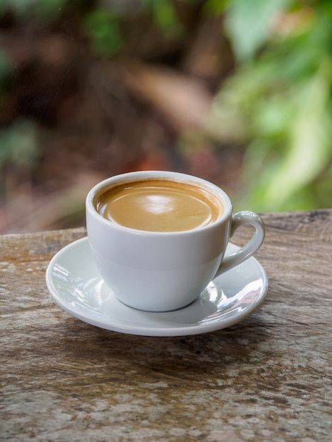 Premium Photo | Cup of fresh coffee with coffee beans on wooden table Hot Americano Coffee, Old Wooden Table, Photo Cup, Americano Coffee, Fresh Coffee, Wooden Table, Wooden Tables, Premium Photo, Coffee Beans