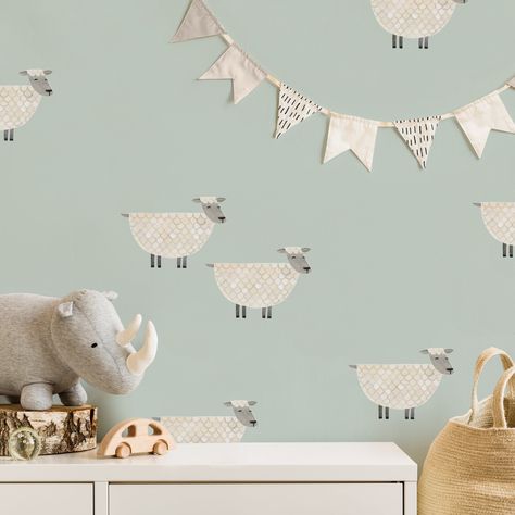 Counting sheep to fall asleep has never been more adorable... or easy to install! These sheep wall decals are such a sweet addition to a gender-neutral nursery. Details + Dimensions: Includes 15 decals Each decal is approximately 4.9" x 7.3" Decals printed on repositionable fabric, not vinyl Printed with archival-quality, non-toxic ink Detailed application instructions included Wait at least 30 days after painting to install decals We are not responsible for decals that do not stick to your wall Sheep Nursery Theme, Counting Sheep Nursery, Farm Themed Nursery, Cartoon Lamb, Whimsical Nursery Decor, Farm Nursery Theme, Childrens Wall Decals, Sheep Nursery, Farm Animal Nursery