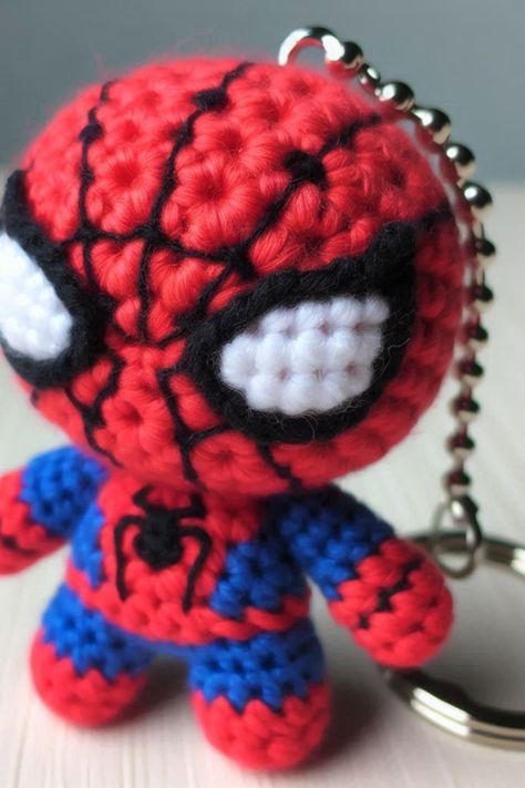 Create a crochet Spider Hero keychain with this fun and easy tutorial. Perfect for fans of the iconic superhero or as a cute gift idea! Deadpool Crochet Keychain, Spiderman Free Crochet Pattern, Crochet Batman Keychain, Spiderman Crochet Keychain, Crochet Spiderman Free Pattern, Crochet Spiderman Keychain, Marvel Crochet Patterns Free, Keychain Amigurumi Free Pattern, Spiderman Crochet Pattern Free