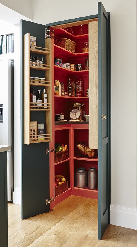 This kitchen was designed for a family with four children. Our clients dreamt of a large sociable island, a breakfast cupboard and a walk-in larder. We answered the entire ‘wish list’ and by reconfiguring internal studwork we created a perfect layout for a modern shaker-style kitchen. Finished in a stunning green which contrasts beautifully with the composite concrete worktops. A natural oak shelf and aged brass handles add a warm touch to the pallet. Pantry Cupboard Designs, Breakfast Cupboard, Kitchen Larder Cupboard, Pantry Closet Design, Funky Kitchen, Kitchen Larder, Diy Kitchen Projects, Larder Cupboard, Barn Kitchen