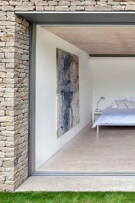 A door opening shown open with pocket doors hidden away into the wall overlooking a lawn Recessed Window, Plaster House, Plaster Board, Cottage Extension, Minimal Windows, Silver Door, Large Cottage, Cotswolds Cottage, Sliding Door Systems