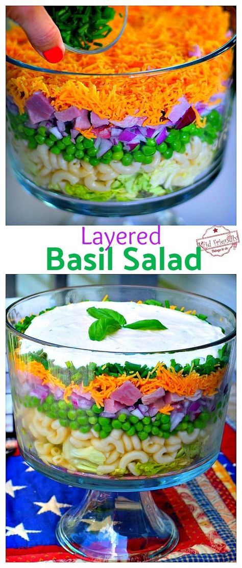 Take this delicious Basil Layered Salad Recipe to your potluck. It's the perfect make ahead dish to feed a crowd and looks so pretty in a trifle bowl. Delicious layers of ham, peas, macaroni, and homemade basil dressing. #makeaheadlayeredsalad #layeredsaladwithpeas #layeredsaladforparties #easylayeredsalad Layered Salad With Peas, Seven Layer Salad Recipe, Layer Salad, Basil Salad, Seven Layer Salad, Layered Salad Recipes, Salads For A Crowd, Make Ahead Appetizers, Trifle Bowl