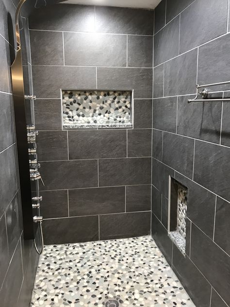 Modern shower remodel using Sliced Bali Turtle Pebble Tile in the niches and as flooring. https://www.pebbletileshop.com/products/Sliced-Bali-Turtle-Pebble-Tile.html#.WPZO728rKUk Pebble Tile Shower, Shower Makeover, Makeover Kamar Mandi, Small Bathroom Remodel Designs, Gray Tile, Bathroom Remodel Cost, Diy Bathroom Remodel, Bathroom Tile Designs, Bathroom Shower Tile