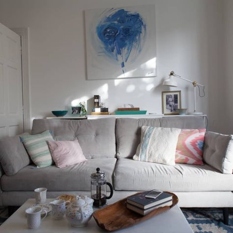 House Tour: A Small Renovated London Flat | Apartment Therapy Sofa In Front Of Radiator, Radiator Behind Sofa, Shelf Behind Sofa, Small London Flat, Behind Sofa, Radiator Shelf, Renovated House, Brown Carpet, Small Bathroom Makeover