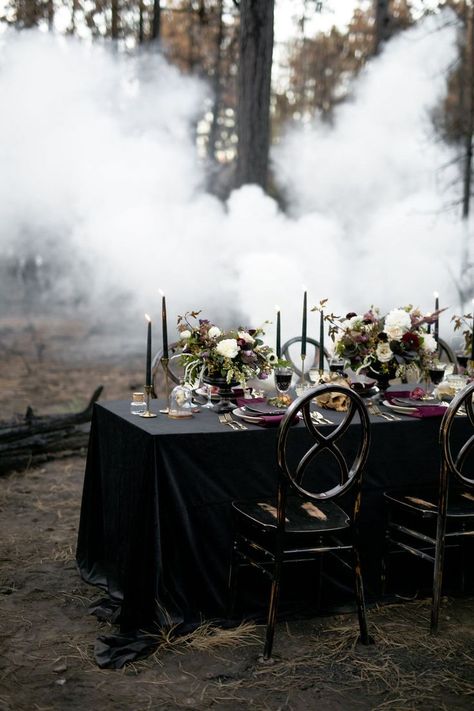 Dark and moody wedding reception tablescape with black table cloth, dark purple tapered candles,and burgundy and white floral centerpieces.| Moody Jewel-Toned Halloween Wedding Inspiration Shoot | #equalitymindedweddings #lgbtweddingmagazine #loveinc #halloweenwedding #halloween #floralcenterpiece #moodyweddingphotography Moody Wedding Reception, Black Table Cloth, Dark And Moody Wedding, Ballet Wedding, Moody Wedding Photography, White Floral Centerpieces, Dark Wedding Theme, Gothic Floral, Halloween Themed Wedding