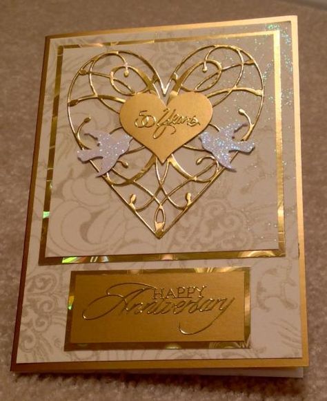 Needed to make a 50th Anniversary card for our friends special day!  I used various gold cardstock and gold stickers from Hobby Lobby.  Used these dies, etc: Memorybox LaRue heart die Stampin Up heart punch Martha Stewart small dove punch TFL and God Bless! Golden Anniversary Cards, Golden Wedding Anniversary Card, 50th Anniversary Cards, Memory Box Cards, Anniversary Cards Handmade, Golden Wedding Anniversary, Golden Anniversary, Elegant Cards, Golden Wedding