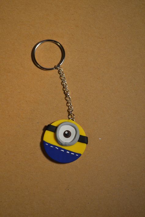 Minion Clay Art, Fevicryl Mouldit Clay Art Keychain, Mouldit Keychain Ideas, Air Dry Clay Ideas Keychain, Gantungan Kunci Clay, Mouldit Clay Keychain, Mouldit Clay Art Keychain, Cardboard Keychain, Clay Art Keychain