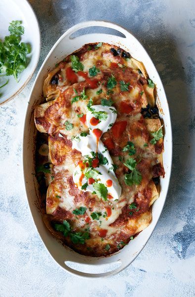 Ali Slagle, Nytimes Cooking, Cheese Enchiladas Recipe, Bean And Cheese Enchiladas, Chipotle In Adobo, Adobe Sauce, Best Enchiladas, Vegetarian Enchiladas, Bean Enchiladas