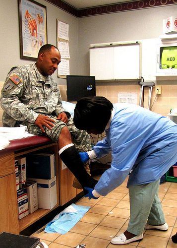 At 4 p.m., July 27, Helaine Walker-Smith, an orthopedics technician in the Orthopedics/Podiatry Clinic, cares for one of her last patients of the day. Here, she fits Sgt. 1st Class Brian D. Hill with a short leg cast. (Photo by Marlon J. Martin, McDonald Army Health Center, Fort Eustis, Va.) Podiatry Clinic, Leg Cast, Us Soldiers, Health Center, Medical Center, Lose Belly Fat, Get Healthy, Belly Fat, Fat Loss