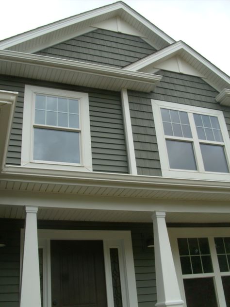 Alside Deep Moss siding and shakes, white pvc accents in the peaks. Ref: Keith Homes 304 Deep Moss Vinyl Siding, Exterior Rock Siding, Alside Siding, Siding Shingles, Housing Exterior, Crib Makeover, Green House Color, Exterior Facelift, Rustic House Exterior