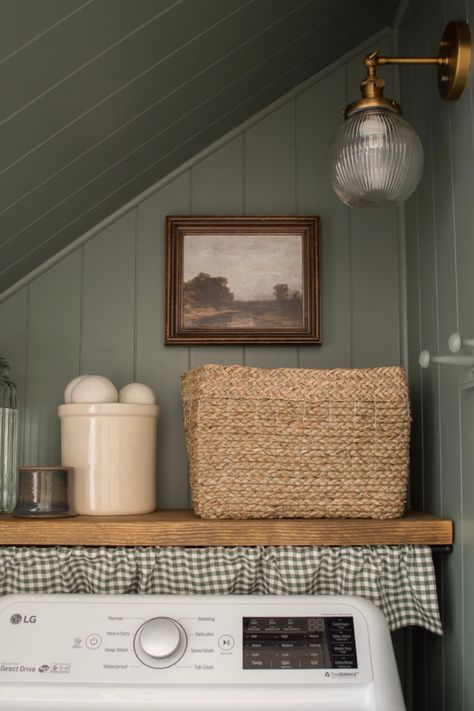 Laundry room transformation from boring and beige to moody and beautiful. Colonial Style Laundry Room, Laundry Room Wall Organization Ideas, Laundry Closet Farmhouse, Light Yellow Laundry Room, Laundry Room Crafts, Laundry Room With Wood Paneling, Cottage Mudroom Laundry Room, Moody Laundry Closet, Small Colorful Laundry Room