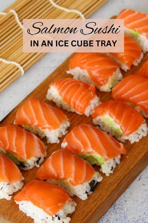 salmon nigiri on a wooden chopping board Ice Tray Sushi, Sushi In Ice Cube Tray, Sushi Ice Cube Tray, Diy Sushi Night, Ice Cube Tray Sushi, Sushi Ideas Homemade, Ice Cube Sushi, Sushi Hacks, Perfect Sushi Rice Recipe