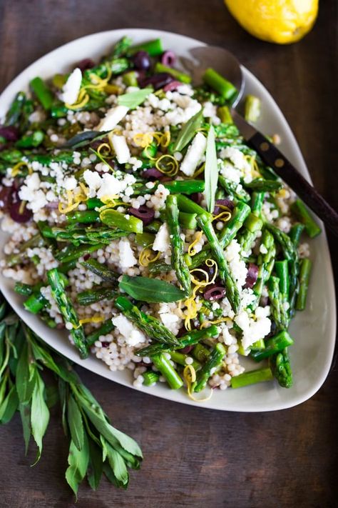 Spring Asparagus Salad with Israeli Cous Cous, kalamata olives, feta, lemon zest and mint with a lemony dressing. #asparagus #asparagusrecipes #easter #asparagus-salad #spring #springsalad #asparagussalad Easter Salads, Lemony Dressing, Asparagus Salad Recipe, Healthy Spring Recipes, Feasting At Home, Asparagus Salad, Cous Cous, Spring Salad, Roasted Asparagus