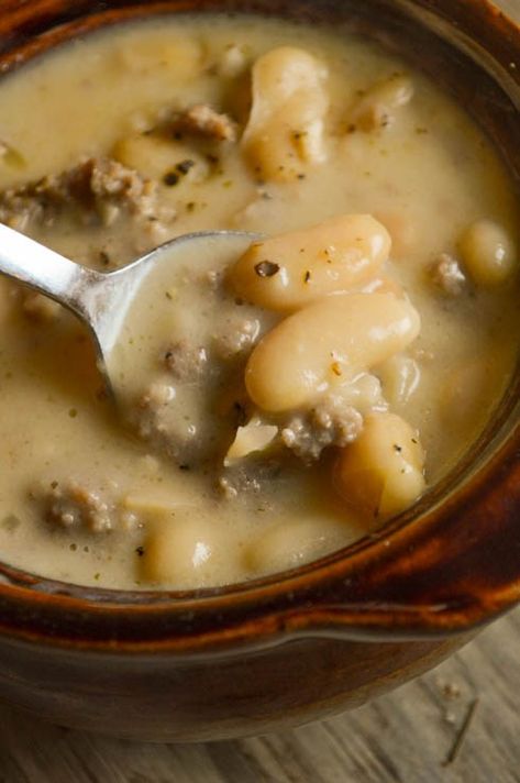 Tuscan Sausage and White Bean Soup is a hearty, flavorful dish perfect for dinner any night of the week. Add some crackers and enjoy! Sausage And White Bean Soup, Tuscan Sausage, Quick Soup, Vegetarian Soup Recipes, Soup Recipes Slow Cooker, Savory Soups, White Bean Soup, Soup And Sandwich, White Bean