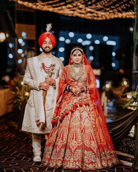 Royal Sikh couple making the statement in most stunning wedding outfits😍 Tag the bride to be who will look beautiful in this beautiful bridal red lehenga.❤ Bride- @muskaankaurnarula MUA: @shahid_naar Outfit: @rimpleandharpreet Jewellery: @khuranajewelleryhouse Photography: @amanphotographyasr Duppata veil: @maksimclothing Mehendi: @sohansmehandi Nails: @artbox_claws_nails Digital Agency - @whitemascotmedia #sikhcouple #sikhcouplephotography #sikhwedding #anandkaraj #punjabicouple Lehenga Bride And Groom, Bridal Red Lehenga, Sikh Couple, Lehenga Bride, Claws Nails, 80k Followers, Latest Bridal Lehenga Designs, Orange Lehenga, Groom Sherwani