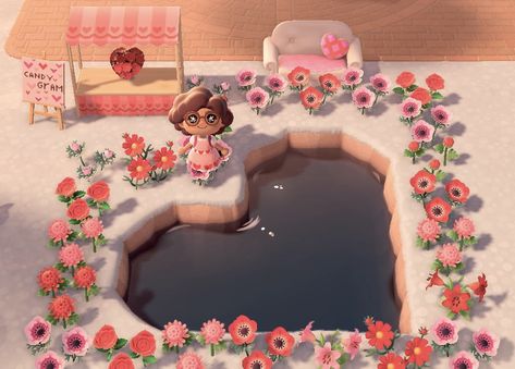 Made a little heart pond/garden for Valentine’s Day to get in the spirit ^_^ Featuring a candy gram stall and a loveseat for photos 💞 How To Make A Heart Pond In Acnh, Acnh Heart Design, Heart Shaped Pond Acnh, Heart Shaped Pond Animal Crossing, Valentines Animal Crossing, Heart Lake Animal Crossing, Acnh Valentines Day Ideas, Acnh Heart Waterfall, Animal Crossing Valentines Day Designs