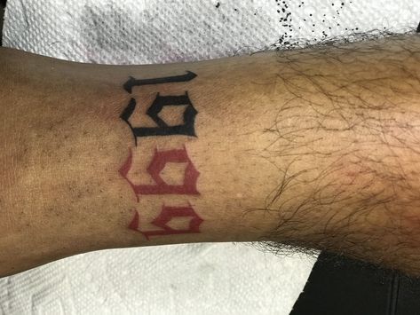 1999 color tattoo red and black number tattoo Tattoo Red And Black, 1999 Tattoo Ideas, 1999 Tattoo, 99 Tattoo, Tattoo Ideas On Arm, Viking Rune Tattoo, Traditional Ideas, Tattoo Number, Tattoo Red