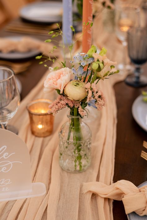 Pastel peach, blue and blush wedding floristy. Wedding bud vases amongst a romantic style tablescape. Floristry by @LilyandLiz. Peach And Pale Blue Wedding, Periwinkle And Peach Wedding, Baby Blue And Peach Wedding, Light Blue And Peach Wedding, Blue Wedding Tablescape, Pastel Tablescape, Wedding Bud Vases, Peach And Blue Wedding, Blue And Peach Wedding