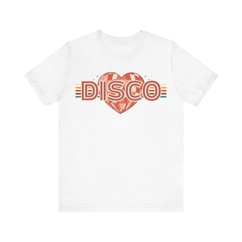 Please be aware: Mockups on human models show a general representation of the t-shirt. All t-shirts are standard Bella Canvas 3001. Pleas refer to size chart (in the picture section) for exact dimensions of the size you're ordering. Transport yourself back to the heyday of disco with our "Love Disco" shirt collection. Featuring bold graphics and vibrant colors, these shirts capture the essence of the disco era in a modern way. Whether you're hitting the club or just want to add some retro flair to your wardrobe, our disco shirts are sure to turn heads. Product features - Made with 100% Airlume combed and ring-spun cotton - Retail fit suitable for casual and semi-formal settings - Tear-away label for minimized skin irritations - Humane and sustainable manufacturing by Bella+Canvas - Lightwe 70s Dance Party, 70s Dance, Disco Shirts, Retro Dance, Vintage Disco, Retro Disco, Groovy 70s, Disco Shirt, Disco Era