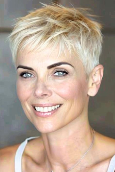 This cropped pixie cut is the epitome of edgy sophistication with its choppy layers that add volume and texture to fine hair.  Click here to see more stunning short hairstyles for women over 50 with fine hair. Pixie Haircut Fine Hair, Short Spiked Hair, Short Hairstyles Fine, Crop Hair, Twitter Artist, Very Short Haircuts, Short Hair Pixie Cuts, Messy Short Hair, Follow Tiktok