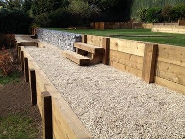 Gabion and Sleeper Walls modern Railway Sleepers Garden, Gabion Wall Design, Sleeper Wall, Sleeper Retaining Wall, Sleepers In Garden, Railway Sleepers, Gabion Wall, Modern Garden Design, Garden Seating