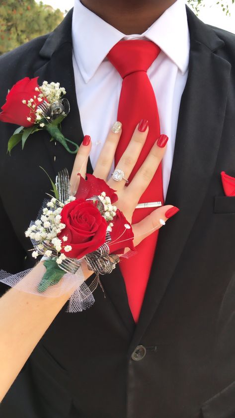 I wore this with a red dress and silver shoes! It worked really well ❤️ Hoco Corsage For Black Dress, Black And Red Prom Flowers, Black Prom Dress Red Accessories, Prom Coursage Ideas Black And Red, Black Prom Dresses With Red Heels, Black And Red Prom Aesthetic, Red Prom Tux Guys, Red Prom Dress With Black Heels, Tux With Red Dress Prom