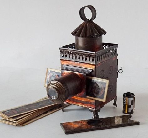 The magic of light was created in the 19th century with these Magic lanterns . The very first kine of slide projectors. https://www.catawiki.com/en/l/55358835-lapierre-petite-lanterne-carree-verni-rouge-8-plaques-une-a-systeme #camera #photography #buyfilmnotpixels #analogue #collectingcameras #vintage #1890s #shootfilm #filmcamera #vintagecamera #projector #magiglantern #victorianage #victoriana #catawiki #catawikicameras Slide Projectors, Magic Lantern, Shoot Film, Vintage Cameras, Film Camera, Camera Photography, Projector, Bookends, The Magic