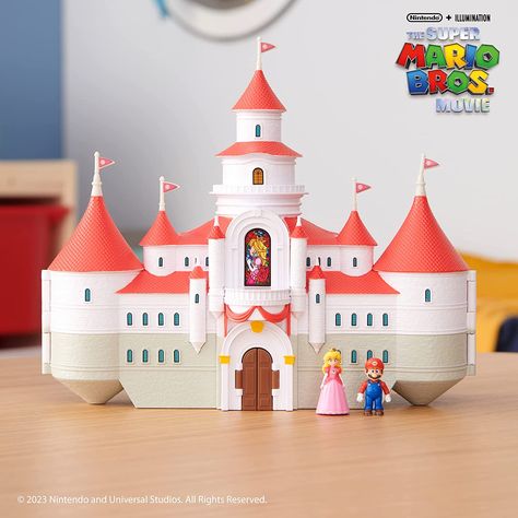 The Super Mario Bros. Movie Mushroom Kingdom playset with 1.25” Mario and Peach figures Inspired by Princess Peach’s Mushroom Kingdom castle from the movie Castle interior opens to nearly 22” wide and recreates the training ground moment from the movie including blocks, piranha plant, Bullet Bill, fire stick, and more! Includes 1.25” mini scale Mario and Peach figures Collect all The Super Mario Bros. Movie Playsets and Action Figures - Each sold separately Super Mario Movie, Princess Peach Party, Kingdom Castle, Mario Movie, The Super Mario Bros Movie, Super Mario Bros Movie, Super Mario Nintendo, Mario And Princess Peach, Peach Mario