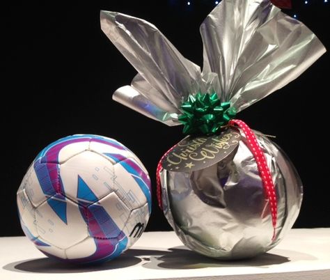 Luxury gift wrapping - how to gift wrap a football by Neelam Meetcha Wrap A Ball With Paper, How To Gift Wrap A Ball, How To Wrap A Football For Christmas, Seran Wrap Gifts, Seran Wrap Christmas Ball, Luxury Gift Wrapping, Football Gifts, A Football, Wrapping Ideas