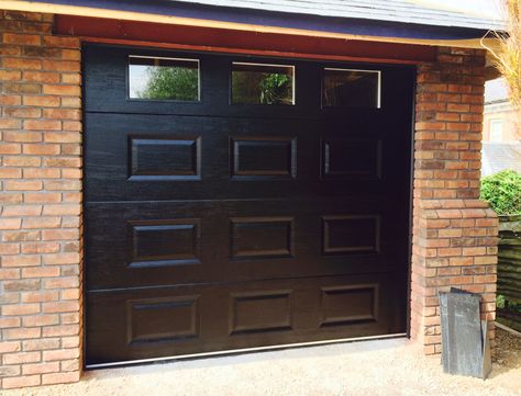 Up and over garage door for use at home from HAG UK. Georgian panel style in a range of colours. Choose from manual or electric operation. Garage Doors Uk, Over Garage Door, Cassette Design, Garage Security, Sliding Garage Doors, Garage Door Windows, Sectional Garage Doors, Sliding Folding Doors, Industrial Door