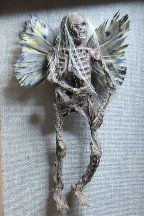 Dead Fairy made mostly from stuff I bought at the Dollar Tree. Check out the video link to see how I made it. Mummified Fairy, Skeleton Fairies, Skeleton Fairy, Art Skeleton, Spooky Halloween Decor, Halloween Decor Diy, Cute Halloween Decorations, Dark Acadamia, Wolf Creek