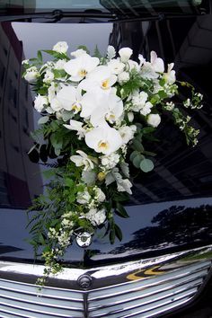 Dramatic against the Black Hood, White Orchids with other White flowers Wedding Car Decor, Wedding Car Deco, Wedding Getaway Car, Bridal Car, Wedding Car Decorations, Car Deco, Wedding Arrangements, White Orchids, Bride Bouquets