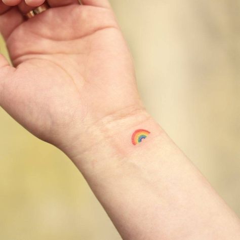 Rainbow tattoo on the wrist Rainbow Wrist Tattoo, Double Rainbow Tattoo, Rainbow Baby Tattoo Ideas, Simple Rainbow Tattoo, Minimalist Rainbow Tattoo, Small Rainbow Tattoo, Rainbow Tattoo Ideas, Misaki Mei, Button Tags