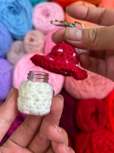 "These mini crochet mushrooms have tiny glass 5ml jars in them! The glass jars have a screw top and can hold tons of tiny things.  They come in 6 different styles:  - Red mushroom  - Neon rainbow mushroom  - Light green mushroom w/ dark green bottom  - Dark green mushroom w/ light green bottom  - Sunshine mushroom  - Starry mushroom  Mushroom Dimensions:  Approximately 2\" tall and 2\" wide at its widest point Keychain Length ~ 1.5\" Please allow for slight variations as the product is handmade. Crochet Pill Bottle Holder, Crochet Secret Stash, Crochet Mushroom Necklace, Crochet Stash Jar, Crochet Mini Keychain, Mini Crochet Keychain, Mushroom Keychain Crochet, Crochet Trinkets, Crochet Mushroom Keychain