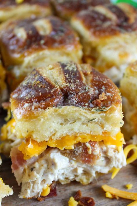 These Chicken Bacon Ranch Sliders are so tasty! Full of rotisserie chicken, melty cheddar cheese, smoky bacon and creamy ranch dressing! These sliders are great for a weeknight dinner or a potluck with friends. Chicken Bacon Ranch Biscuits, Chicken Bacon Ranch Sandwich Recipes, Sliders With Pretzel Buns, Chicken Bacon Ranch Sliders Crockpot, Pretzel Bun Sliders, Chicken Bacon Ranch Sliders, Bacon Ranch Sliders, Ranch Sliders, Chicken Bacon Ranch Bake