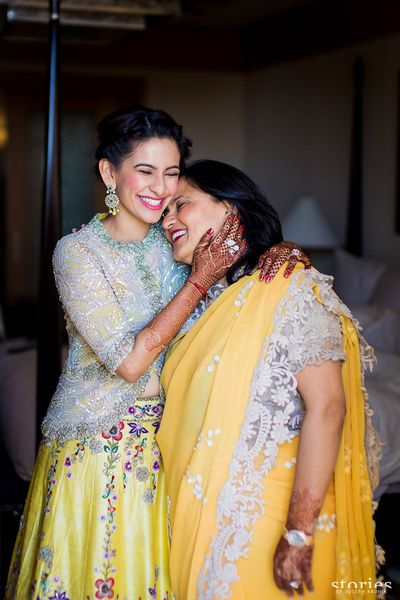 Mother of the Bride - Bride in a Yellow Floral Lehenga with a White Sequinned Jacket and the Mother in a Yellow Saree with Lace Borders | WedMeGood #wedmegood #motherofthebride #motherofthebrideoutfit #yellow #mehandioutfit #sangeet Mother Daughter Poses, Modern Indian Wedding, Mother Daughter Photos, Mother Daughter Photography, Saree Poses, Pink Lehenga, Mother Of The Bride Outfit, Beautiful Wedding Photos, Bride Photo