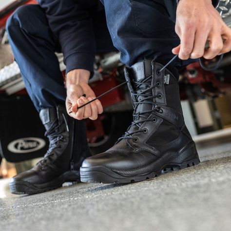 policeman tying the laces of the 5.11 A.T.A.C. 2.0. boot Police Boots, Firefighter Boots, Plate Carrier Vest, Duty Gear, Tactical Shoes, Sling Pack, Tactical Pants, Waterproof Hiking Boots, Tactical Boots