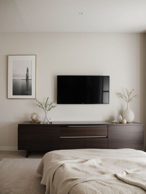 Make a statement in your bedroom by hanging a gallery wall of diverse artwork above your TV. Pair it with a sleek media console and stylish accent lighting for a contemporary and sophisticated look. Accent Lighting, Media Console, Gallery Wall, Sleek, Media, Bedroom, Lighting, Tv, Wall