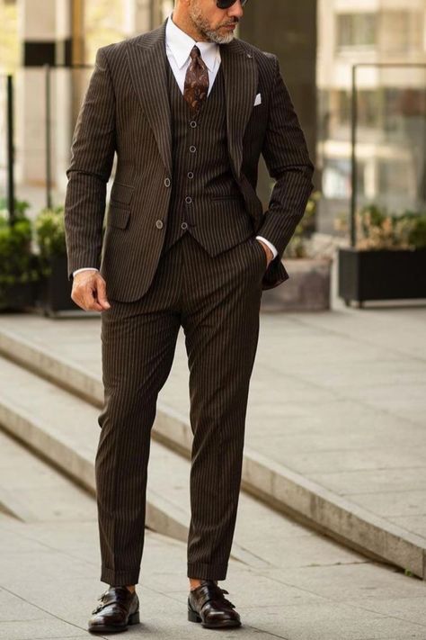 A brown pinstripe suit like this makes the perfect wedding suit for any man. Groom stye like this suit wil make you stand out at your wedding, while complimenting your partner. If you would like a suit like this custom made for you, book an appointment online with us at Giorgenti New York! Pinstripe Suit Wedding, Pinstripe Suit Outfit, Pin Stripe Suit Mens, Brown Suit Wedding, Brown Pinstripe Suit, 1920s Suit, Prom Vibes, Suit Inspiration, Boss Suits