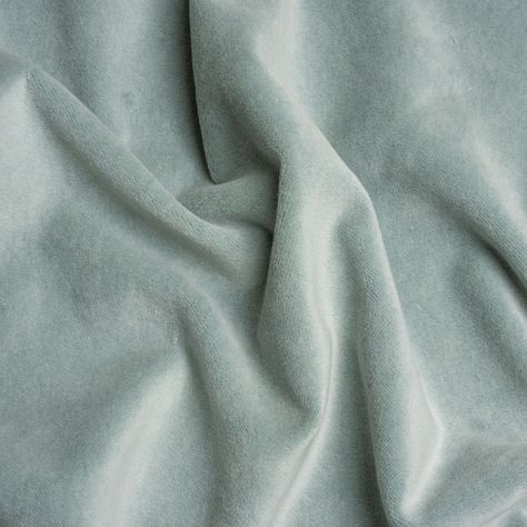 Soften your space with this pastel Banton Breeze Cotton and Polyester Upholstery Velvet. Luxe interiors begin with velvet, a textile equal in modern sophistication as comfort. The muted, light sea-blue face brings this cotton and polyester fabric down to earth, displaying a digestible color ideal for blending with other textures, colors, and design styles.  Featuring a soft face, modest luster, and supple drape, you can easily elevate your home with tufted headboards, throw pillows, and armchair Seafoam Green Fabric, Soft Fabric Texture, Tufted Headboards, Green Velvet Fabric, Soft Face, Velvet Couch, Pale Aqua, Blue Face, Mood Fabrics