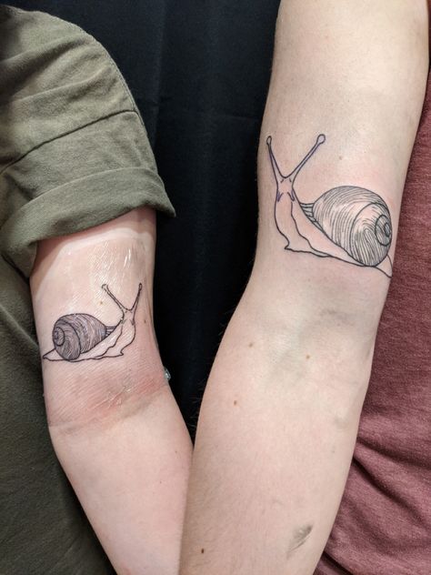 matching snail tattoos with fingerprints on the shells! Botanical Snail Tattoo, Matching Snail Tattoo, Snail Tatoos, Sweet Tooth Tattoo, Snail Tattoo Simple, Matching Nature Tattoos, Snail Tattoos, Goldfish Tattoo, Snail Tattoo