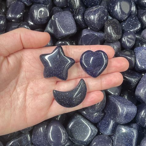 Add a touch of magic to your crystal collection with our stunning Blue Goldstone stars, hearts, and moons! Each piece is unique, with shimmering flecks that resemble a starry night sky. Blue Goldstone is known to promote confidence, vitality, and positive energy. Perfect for gifting to a loved one or treating yourself to something special. #bluegoldstone #crystalhearts #crystalcarving #crystalcollection #melbournecrystals Wholesale Crystals, Crystal Aesthetic, Witchcraft Spells, A Starry Night, Blue Goldstone, Earth Elements, Starry Night Sky, Treating Yourself, Minerals And Gemstones