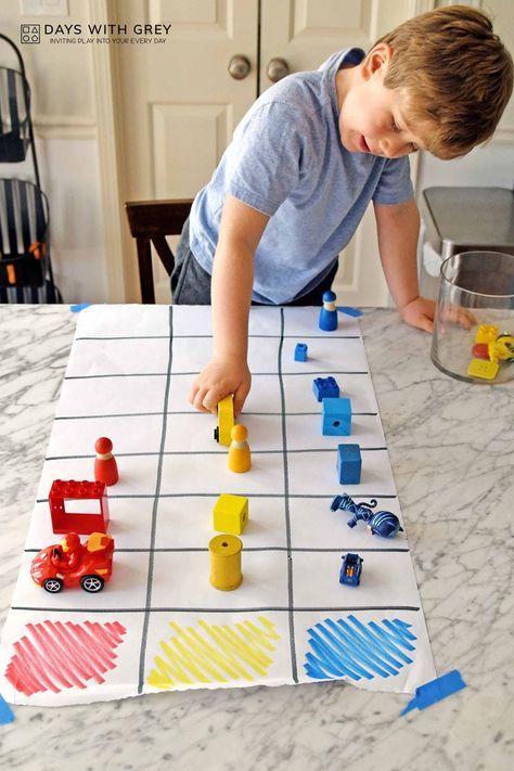 Preschooler putting a yellow toy on the large graph on the table. Preschool Graphs, Easy Indoor Activities, Games For Preschoolers, Compare Numbers, Learning Games For Preschoolers, Math Sort, Preschool Activities At Home, Preschool Math Games, Color Sorting Activities