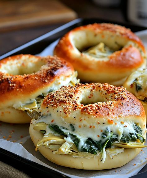 Cheesy Spinach-Artichoke Bagels Spinach Artichoke Buns, Spinach Artichoke Dinner Recipes, Cheesy Spinach, Plain Bagel, Canned Artichoke Hearts, Brunch Spread, Crowd Pleasing Appetizers, Homemade Bagels, Spinach Artichoke Dip