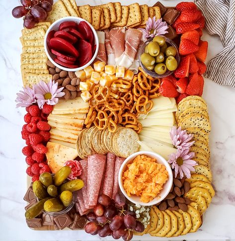 Charcuterie board full of meats, cheeses, veggies, crackers, and more Homemade Charcuterie Board, Homemade Charcuterie, Diy Charcuterie Board, Charcuterie Trays, Charcuterie Board Diy, Charcuterie Board Meats, Charcuterie Board Ideas, Charcuterie Inspiration, Charcuterie Platter