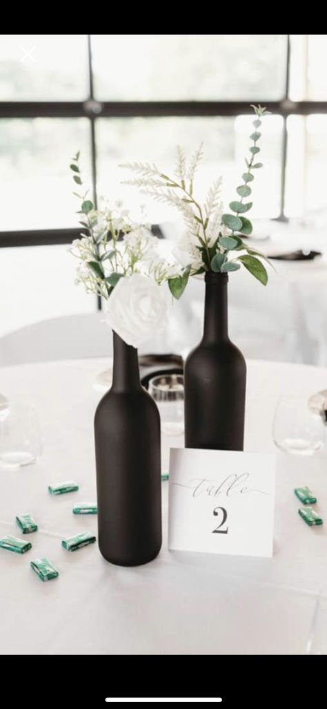 Black Bottle Centerpieces, Simple Black And White Wedding Centerpieces, Cheap Black And White Wedding Decor, Black Vase With Flowers Centerpieces, Black White And Silver Wedding Centerpieces, Bridal Shower Table Centerpieces Simple, Black And Green Engagement Party, Simple Black Centerpiece, Black And White Bridal Shower Centerpieces