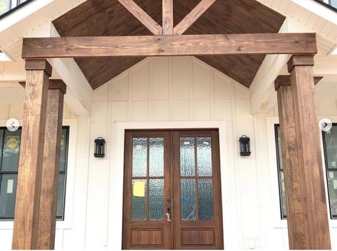 stained wood pillars at entrance Wooden Columns Porch, Wood Pillars Front Porch, White House With Stone, Homestead Plans, Wood Pillars, Sky House, Cottage Exteriors, Wooden Columns, Front Facade